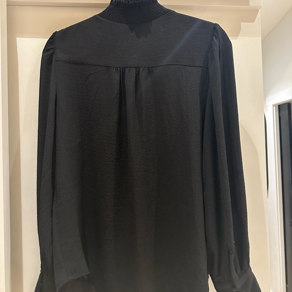 Size M. Black long sleeved blouse with cute detail on shoulders and cuff. - Picture 3 of 5